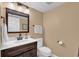 Bathroom featuring vanity, stylish mirror, and toilet at 1055 Kensington Park Dr # 402, Altamonte Springs, FL 32714