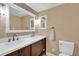 Bathroom featuring dual sinks, vanity, and neutral color palette at 1055 Kensington Park Dr # 402, Altamonte Springs, FL 32714