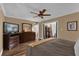 Bedroom featuring wood-look floors, ceiling fan and a large dresser at 1055 Kensington Park Dr # 402, Altamonte Springs, FL 32714