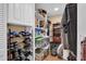 Organized walk-in closet with shelving and storage containers at 1055 Kensington Park Dr # 402, Altamonte Springs, FL 32714