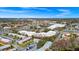 Aerial view of property and nearby commercial area with tennis courts; red marker denotes property at 127 Georgetown Dr # 127, Casselberry, FL 32707