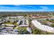 Aerial view of property near a shopping center with a large parking lot; red marker denotes property at 127 Georgetown Dr # 127, Casselberry, FL 32707