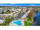 Aerial view of community near the water; pool in foreground at 127 Georgetown Dr # 127, Casselberry, FL 32707