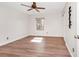 Bedroom featuring wood-look floors, a ceiling fan, a window, and a closet with an organizer at 127 Georgetown Dr # 127, Casselberry, FL 32707