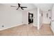 Cozy living area featuring tile flooring, a modern ceiling fan, and a view into the kitchen at 127 Georgetown Dr # 127, Casselberry, FL 32707