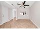 Cozy living area featuring tile flooring, a modern ceiling fan, and a view into the kitchen at 127 Georgetown Dr # 127, Casselberry, FL 32707