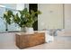 Stylish bathroom countertop with decorative plant, wooden box, rolled towels, and modern chrome faucet at 13270 Panama Beach Ct, Orlando, FL 32827