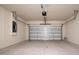 Spacious garage with ample room for parking and storage, featuring an electric door at 13270 Panama Beach Ct, Orlando, FL 32827