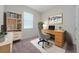 Cozy home office space with a wooden desk, comfortable chair, and ample storage at 13270 Panama Beach Ct, Orlando, FL 32827