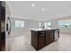 Kitchen island with stainless steel dishwasher and sink overlooking the living area at 13270 Panama Beach Ct, Orlando, FL 32827