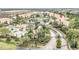 Aerial view of community featuring multiple buildings, pool, landscaping and entrance at 13500 Turtle Marsh Loop # 839, Orlando, FL 32837