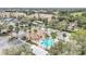 Aerial view of the complex, highlighting the pool, clubhouse, and parking at 13500 Turtle Marsh Loop # 839, Orlando, FL 32837