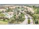 Aerial view of community featuring multiple buildings, pool, landscaping and entrance at 13500 Turtle Marsh Loop # 839, Orlando, FL 32837