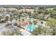 Aerial view of the complex, showcasing the pool and surrounding landscaping at 13500 Turtle Marsh Loop # 839, Orlando, FL 32837