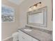 Bright bathroom featuring a granite countertop, decorative mirror and modern sink at 13500 Turtle Marsh Loop # 839, Orlando, FL 32837