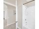 Bright bathroom featuring a white tiled shower and tub at 13500 Turtle Marsh Loop # 839, Orlando, FL 32837