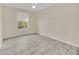 Neutral bedroom featuring tile floors, ceiling fan, and a large window with natural light at 13500 Turtle Marsh Loop # 839, Orlando, FL 32837