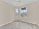 Sunlit bedroom featuring tile floors, ceiling fan and two large windows at 13500 Turtle Marsh Loop # 839, Orlando, FL 32837