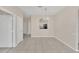 Bright dining room with tile floors, neutral paint, and an arched pass-through to the kitchen at 13500 Turtle Marsh Loop # 839, Orlando, FL 32837