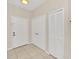 Neutral condo entryway featuring tile flooring and closet space at 13500 Turtle Marsh Loop # 839, Orlando, FL 32837