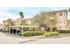Condo building with covered parking and verdant landscaping at 13500 Turtle Marsh Loop # 839, Orlando, FL 32837