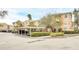 Apartment complex featuring covered parking and well-maintained landscaping at 13500 Turtle Marsh Loop # 839, Orlando, FL 32837