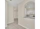 View of the kitchen with white cabinetry, granite countertops, and stainless steel appliances at 13500 Turtle Marsh Loop # 839, Orlando, FL 32837