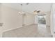 Bright living room with tile flooring, chandelier, and a sliding door to the balcony at 13500 Turtle Marsh Loop # 839, Orlando, FL 32837