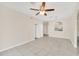 Open living room featuring tile floors, a ceiling fan, and neutral paint tones at 13500 Turtle Marsh Loop # 839, Orlando, FL 32837