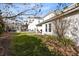 Picturesque backyard with lush greenery and a charming covered patio at 1440 Pro Shop Ct, Davenport, FL 33896
