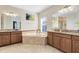 Bright bathroom with dual sinks, a soaking tub, and a separate shower at 1440 Pro Shop Ct, Davenport, FL 33896