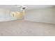 Spacious bonus room with neutral carpet and ceiling fan for added comfort at 1440 Pro Shop Ct, Davenport, FL 33896