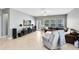Spacious living room with tile floors, a comfortable leather sofa, and a media center, creating a relaxing atmosphere at 1440 Pro Shop Ct, Davenport, FL 33896