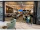 Elegant restaurant with tables, chairs, modern chandeliers and decorative wood accents at 1440 Pro Shop Ct, Davenport, FL 33896