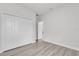 Neutral bedroom with spacious closet and light-colored wood floors, offering a clean and modern feel at 14889 Sw 46Th Ct, Ocala, FL 34473