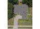 An aerial view showcases the home's layout, with a paved driveway, lush lawn, and surrounding greenery at 15313 Hayworth Dr, Winter Garden, FL 34787