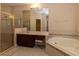 Bathroom featuring a tub, vanity and glass shower at 15313 Hayworth Dr, Winter Garden, FL 34787