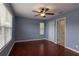 Blue bedroom featuring natural light, a ceiling fan, and wood floors at 15313 Hayworth Dr, Winter Garden, FL 34787