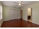 Open bedroom with wood floors, closet, and open access to the bathroom at 15313 Hayworth Dr, Winter Garden, FL 34787