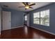 Spacious bedroom featuring hardwood floors, ceiling fan and plenty of natural light at 15313 Hayworth Dr, Winter Garden, FL 34787