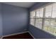 Bedroom with hardwood floors and large window showing community view at 15313 Hayworth Dr, Winter Garden, FL 34787