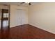 Bedroom featuring hardwood floors, ceiling fan, and closet at 15313 Hayworth Dr, Winter Garden, FL 34787