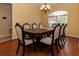 Elegant dining room featuring a large table with seating for eight and a chandelier at 15313 Hayworth Dr, Winter Garden, FL 34787