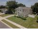 A charming two-story home with a spacious front yard, lush landscaping, and a welcoming curb appeal at 15313 Hayworth Dr, Winter Garden, FL 34787