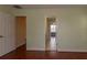 Hallway with views to bedrooms and wood floors at 15313 Hayworth Dr, Winter Garden, FL 34787