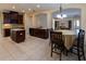 Open kitchen with an island, stainless steel appliances, dark wood cabinets, and breakfast nook at 15313 Hayworth Dr, Winter Garden, FL 34787