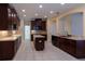 Spacious kitchen showcases wood cabinets, granite countertops, an island, and stainless appliances at 15313 Hayworth Dr, Winter Garden, FL 34787