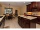 Stylish kitchen with dark cabinetry, tiled backsplash, and stainless steel appliances at 15313 Hayworth Dr, Winter Garden, FL 34787