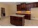 Bright kitchen features an island, beautiful cabinets and mosaic tile backsplash at 15313 Hayworth Dr, Winter Garden, FL 34787