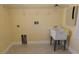 Spacious laundry room with sink, shelving and yellow walls at 15313 Hayworth Dr, Winter Garden, FL 34787